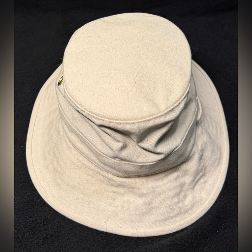 Tilley cream colored bucket hat.  Used in good condition.